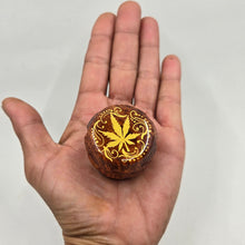 Load image into Gallery viewer, Mini/ tiny 4 part Herb Grinder with Kief catcher. Hand painted weed leaf on imitation wood. Sharp teeth, magnetic closure with smooth grinding
