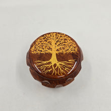 Load image into Gallery viewer, Medium size 4 part Herb Grinder with Kief catcher. Hand painted tree of life on imitation wood. Sharp teeth, magnetic closure with smooth grinding
