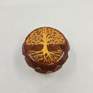 Medium size 4 part Herb Grinder with Kief catcher. Hand painted tree of life on imitation wood. Sharp teeth, magnetic closure with smooth grinding