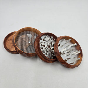 Medium size 4 part Herb Grinder with Kief catcher. Hand painted tree of life on imitation wood. Sharp teeth, magnetic closure with smooth grinding